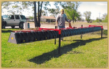 Cajun Ag | 8 row broadcast sprayer kit mounted on cropmaker toolbar